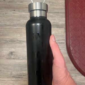 Disney Parks Black Stainless Steel Water Bottle with Mickey Mouse lid.